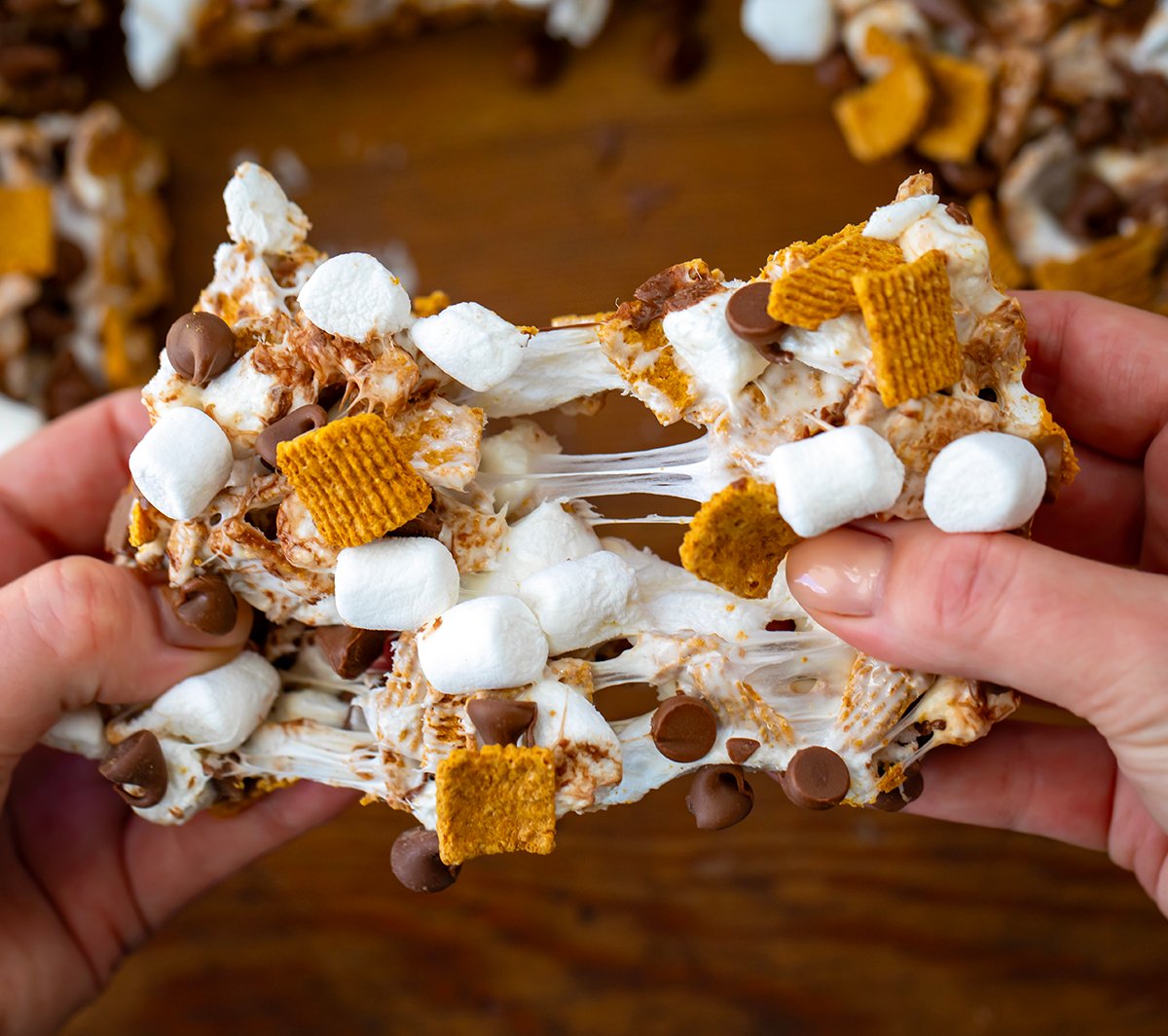 Hands pulling apart a S'mores Bars.