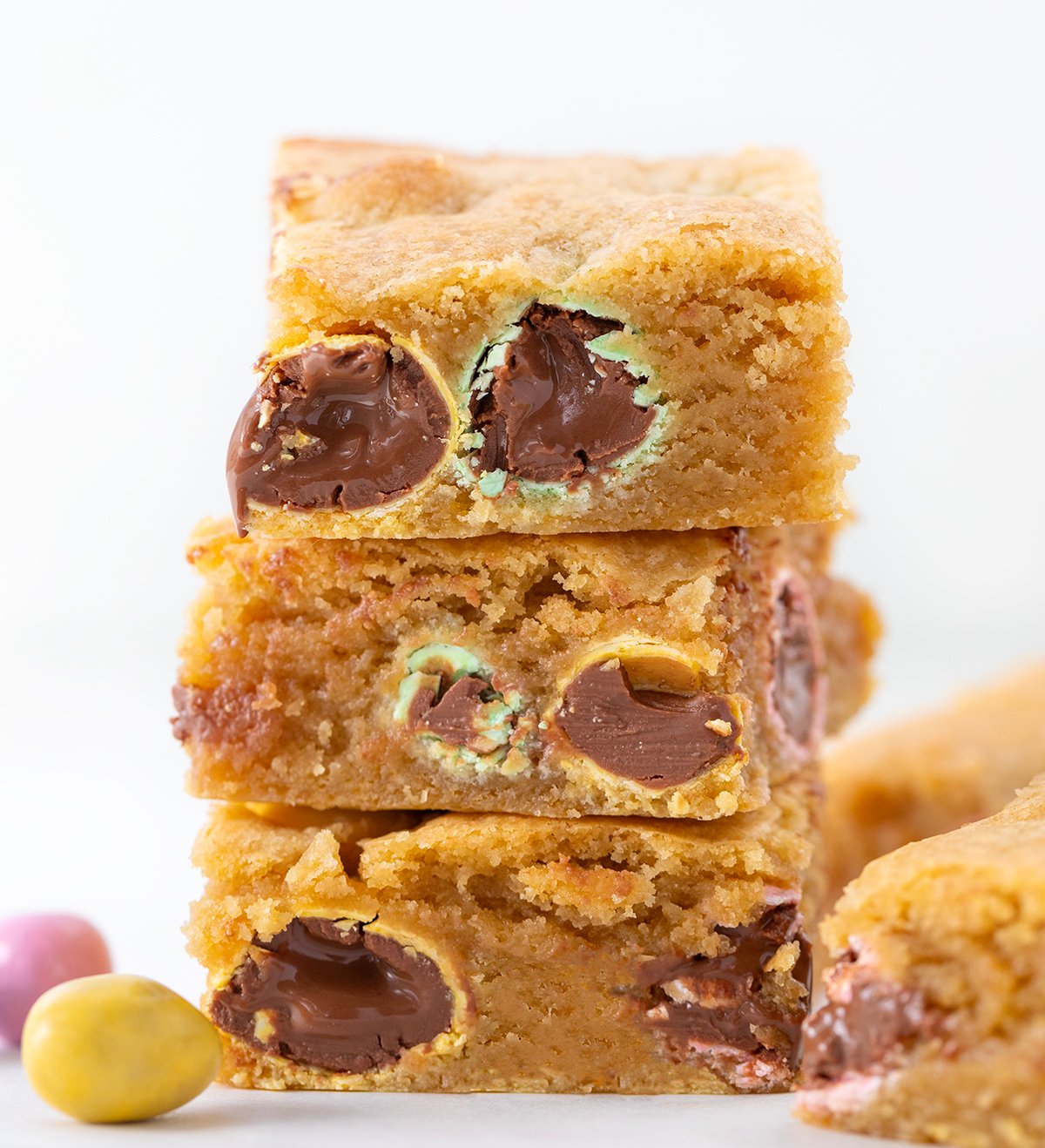 Stack of Easter Blondies showing the robins egg chocolates inside.