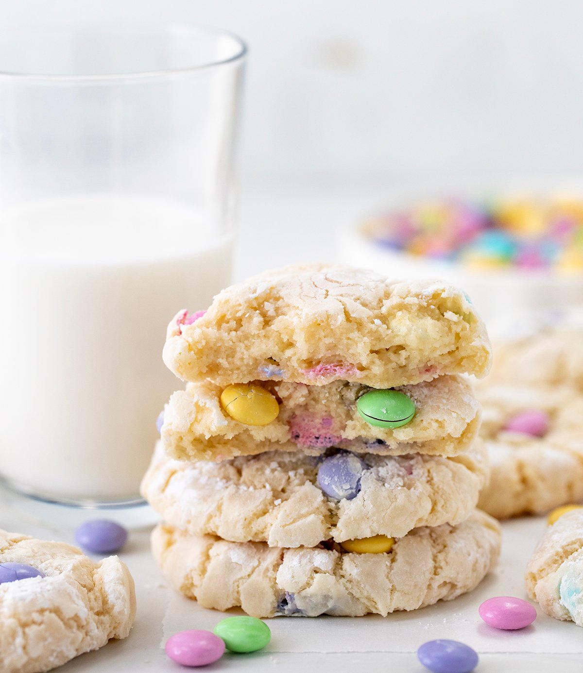 Stack of Easter Ooey Gooey Butter Cookies surrounded by more cookies.