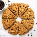 Peanut Butter Chocolate Chip Scones in a circle on a white table rom overhead.