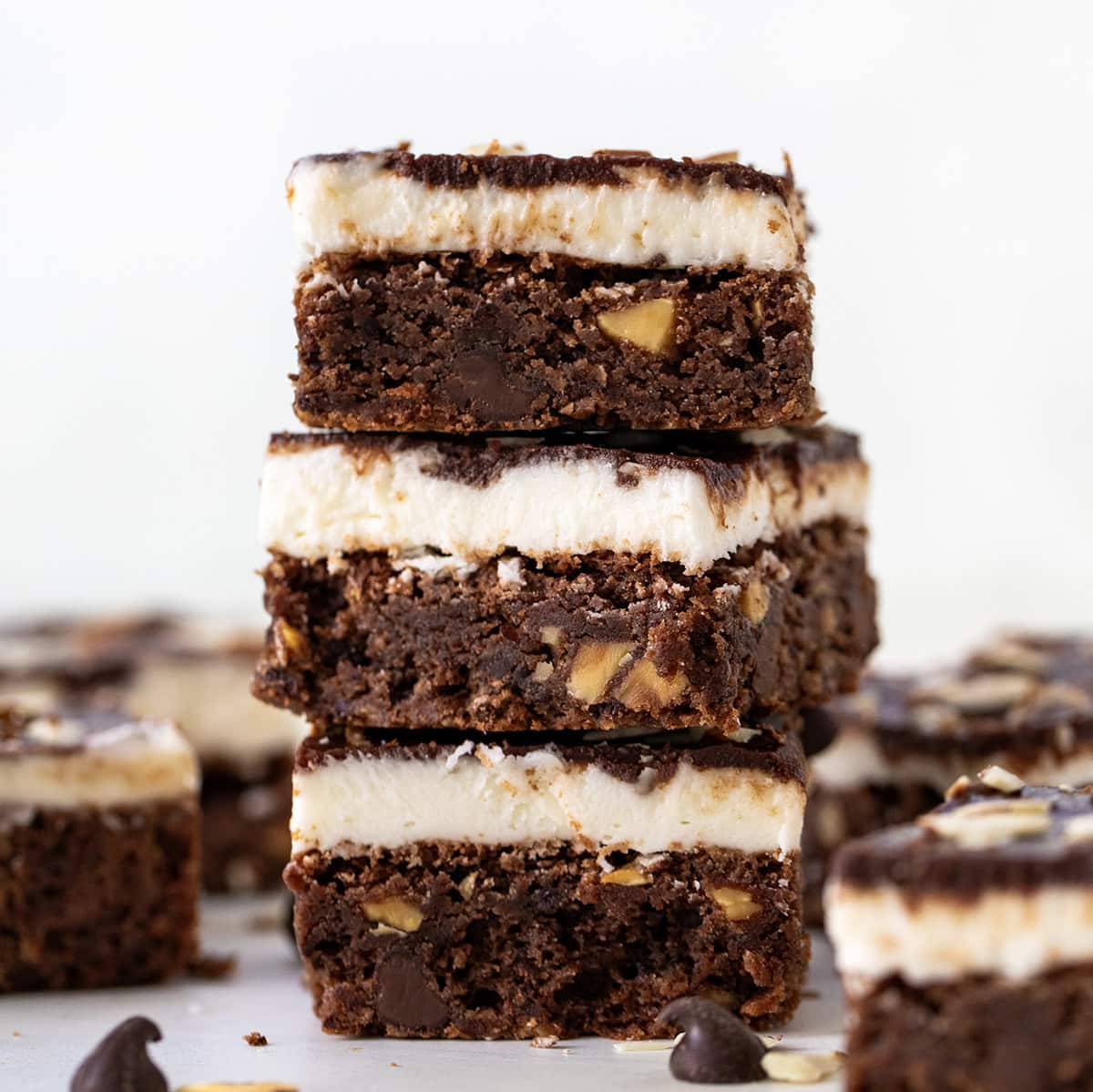 Stack of Sherry Almond Brownies on a white table.