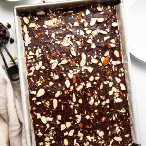 Pan of Sherry Almond Brownies on a white table from overhead.