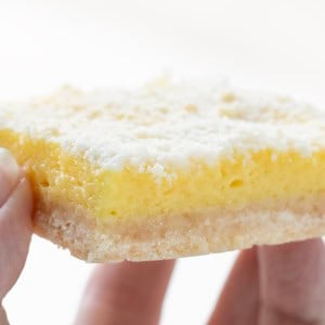 Hand holding Sugar Cookie Lemon Bar.