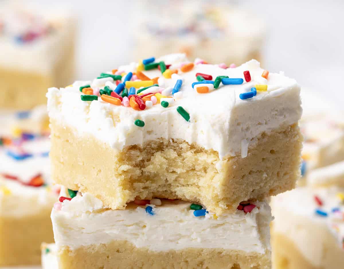 Close up of a Birthday Sugar Cookie Bar with a bite taken out of it.