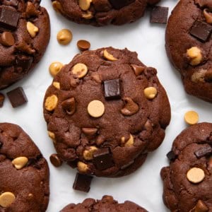 Peanut Butter Chocolate Chunk Cookies on a white table from overhead.