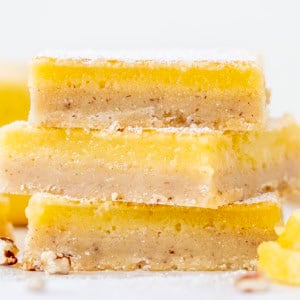 Stack of Lemon Bars with Pecan Crust very close up.