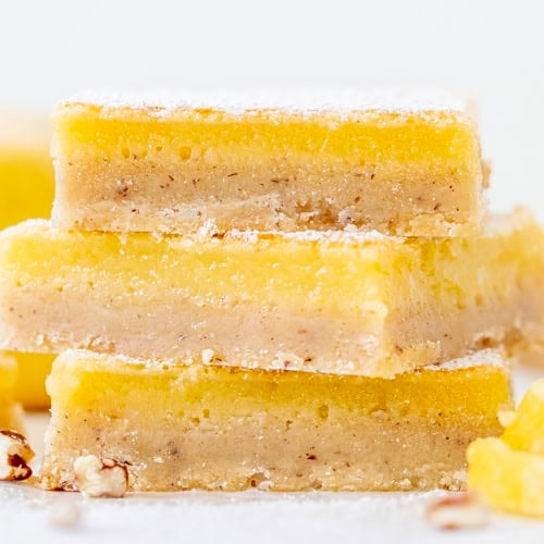 Stack of Lemon Bars with Pecan Crust very close up.