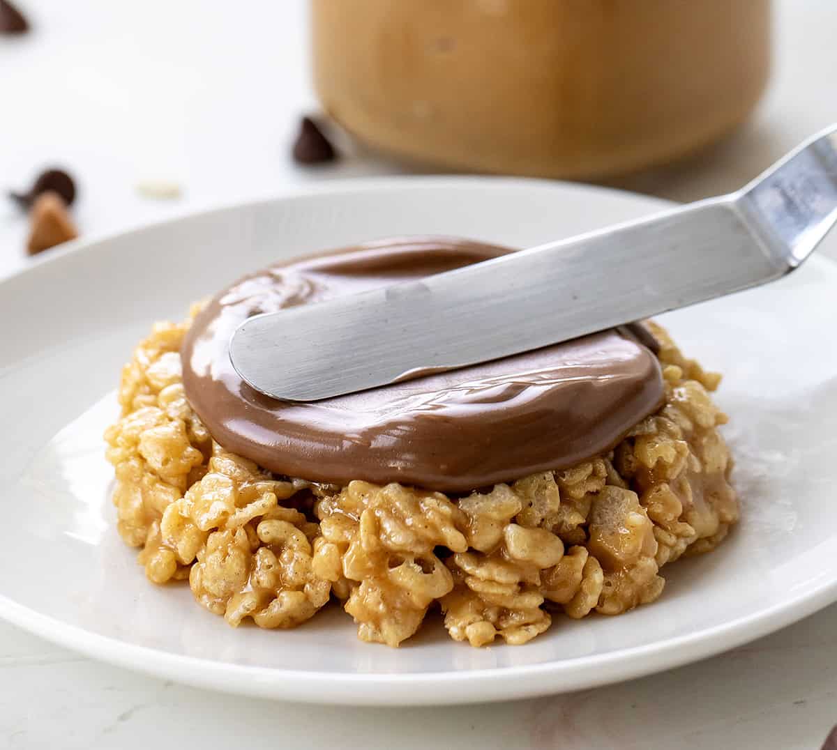 This One-Minute Scotcheroo (made in a mug) is my go-to when I’m craving something sweet and quick, just for me! All the classic Scotcheroo flavor, shaped like a cookie, no oven needed! Adding chocolate to a Single-Serving Scotcheroo.