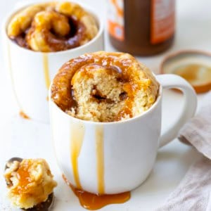 Caramel Roll in a Mug with a portion removed to show texture.