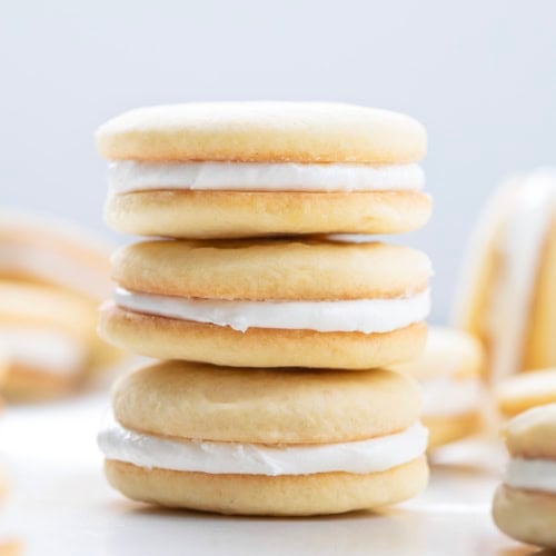 Stack of Golden Oreo Cookies on a white table.