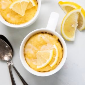 Lemon Mug Cakes on a white table from overhead.