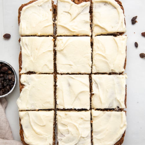 Oatmeal Raisin Cookie Bars cut into squares on a white table from overhead.