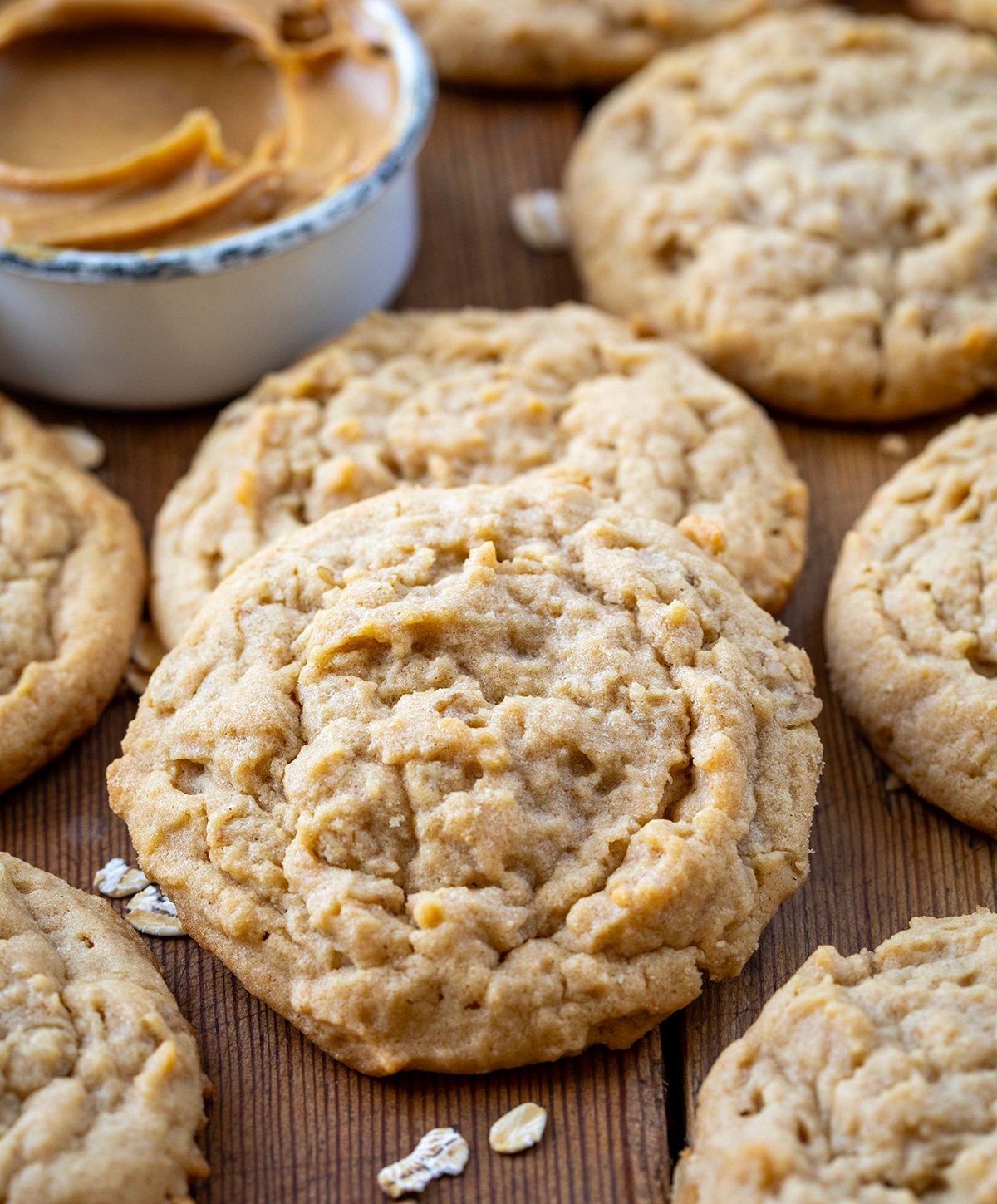 Close up of Peanut Butter Oatmeal Cookies on a wooden table.