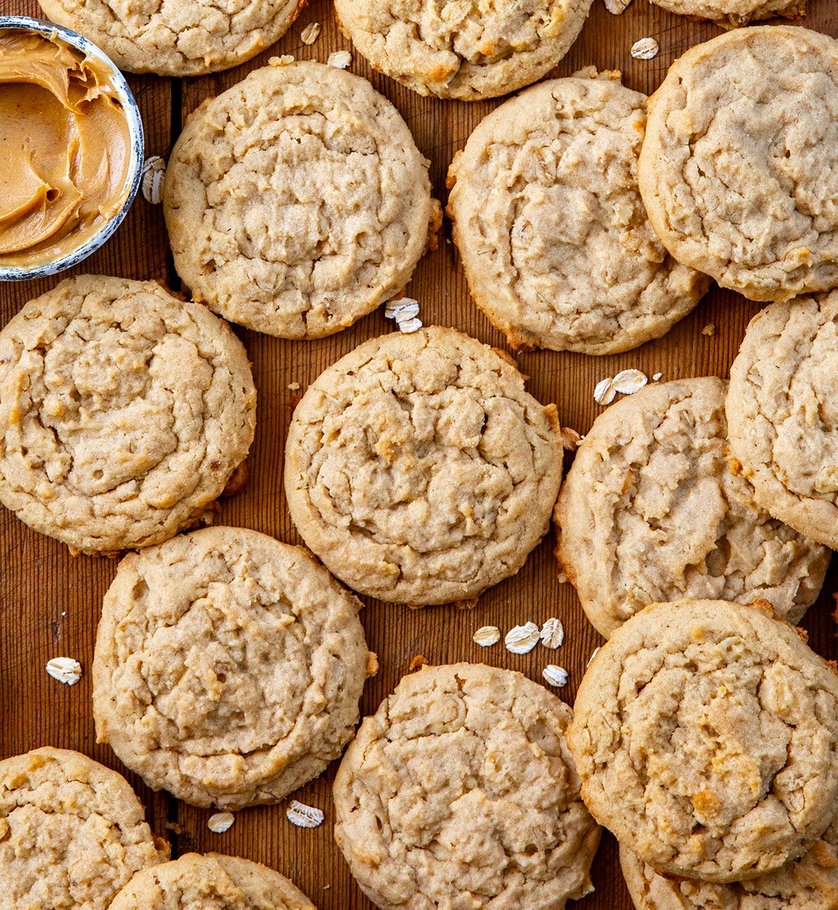 Peanut Butter Oatmeal Cookies on a wooden table all spread out from overhead.