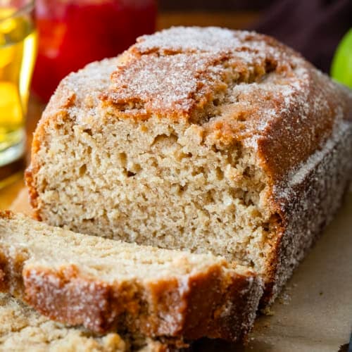 Close up of Apple Cider Donut Bread that has been cut into with pieces falling.