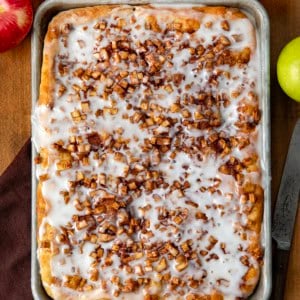 Pan of Apple Fritter Focaccia on a wooden table from overhead.
