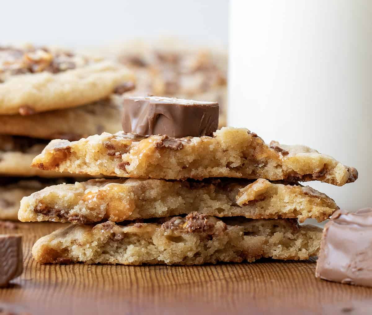 Stack of halved Snickers Cookies showing the inside.