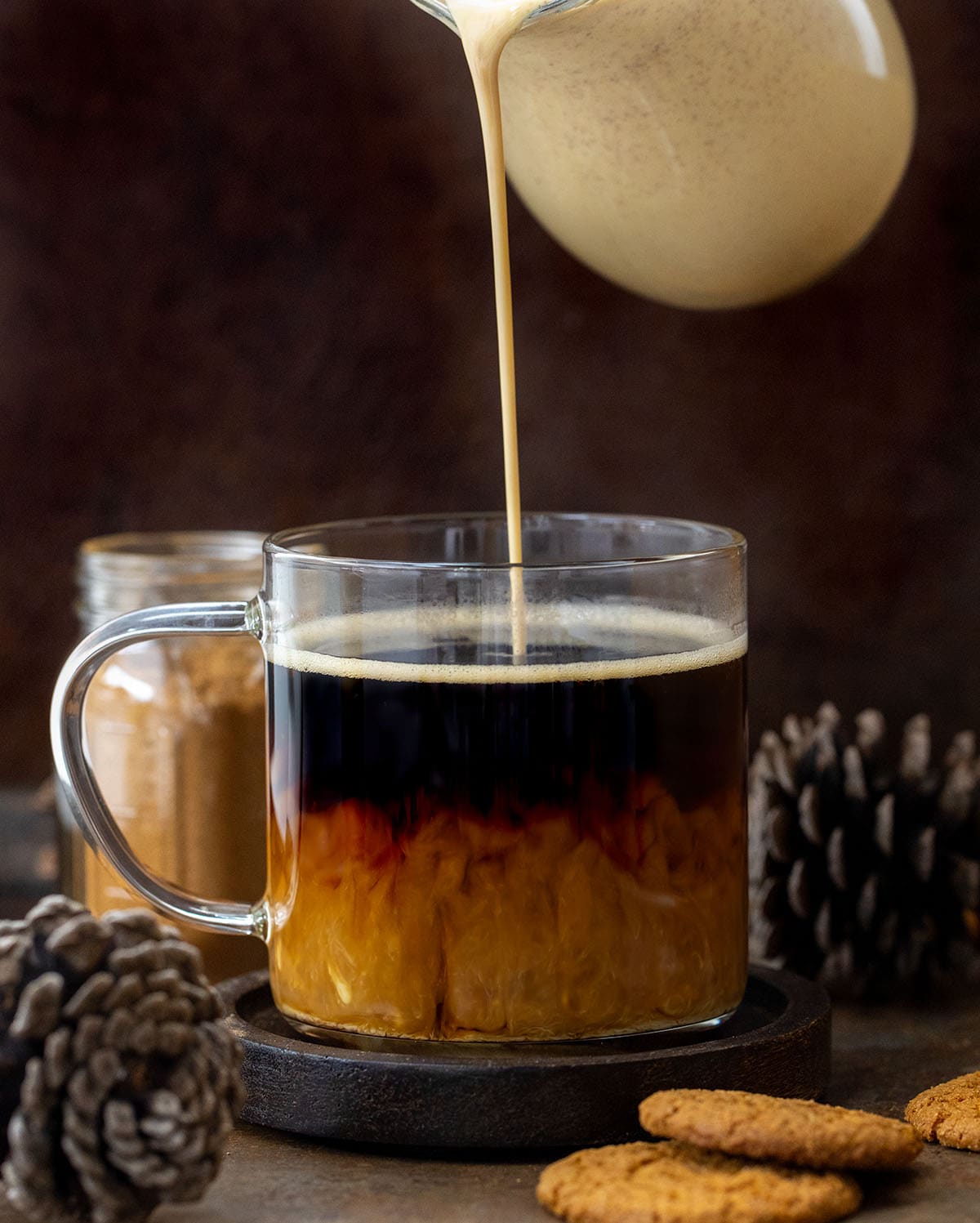 Bring the cozy flavors of the season to your morning coffee with this Homemade Gingerbread Creamer! Rich, creamy, and perfectly spiced with notes of cinnamon, ginger, and nutmeg, it’s a simple way to upgrade your coffee or latte at home with no specialty store trips required! Pouring Gingerbread Creamer into a cup of coffee.