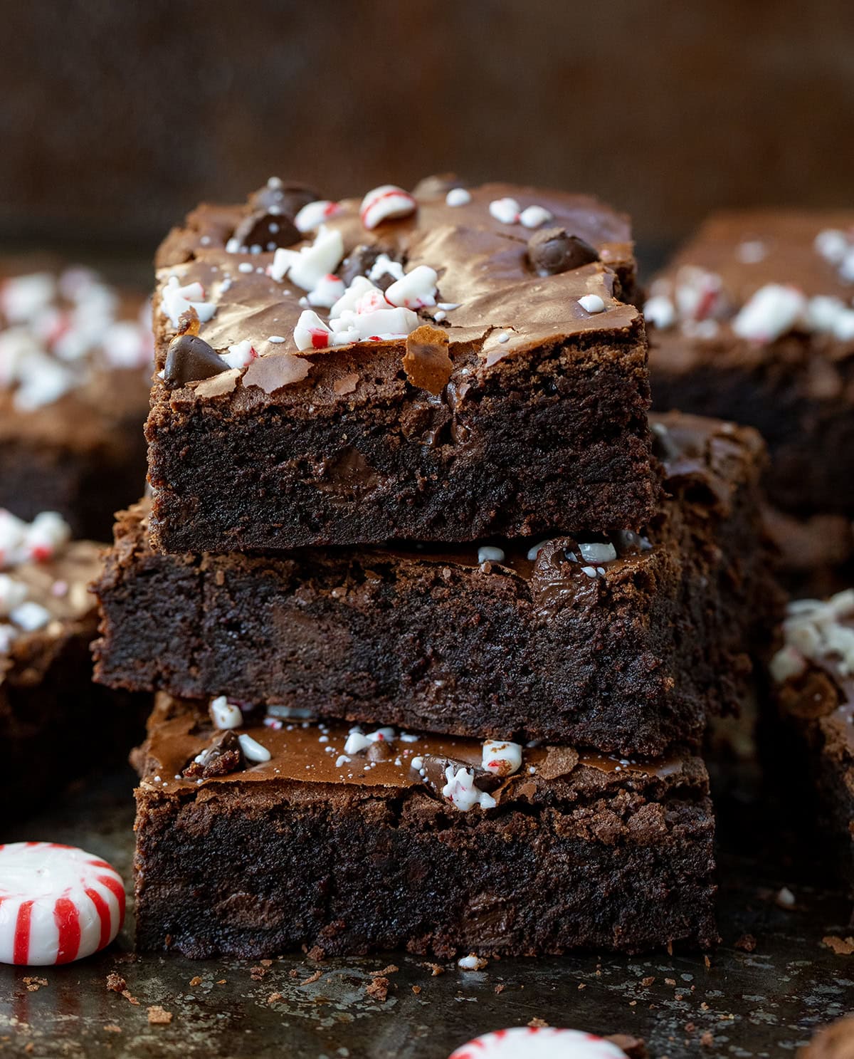 Stack of Peppermint Brownies with more brownies around it.