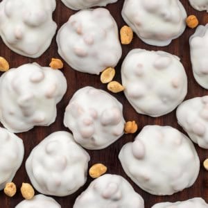 Polar Bear Paws spread out on a wooden table with peanuts from overhead.
