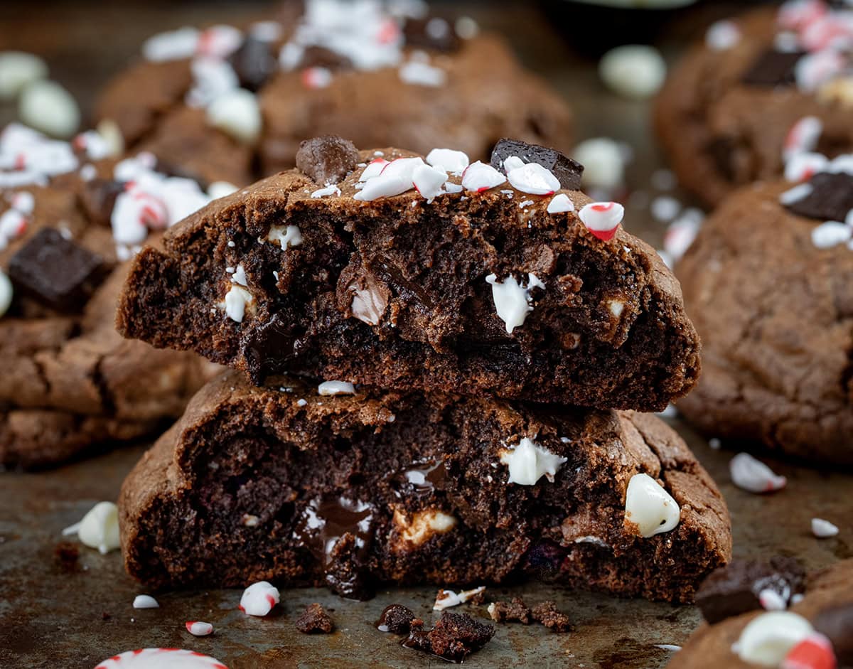 Triple Chocolate Peppermint Cookie halved and stacked on itself close up.