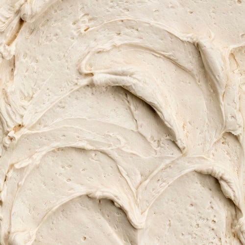 Swirls in a close up shot of Brown Sugar Ermine Frosting.