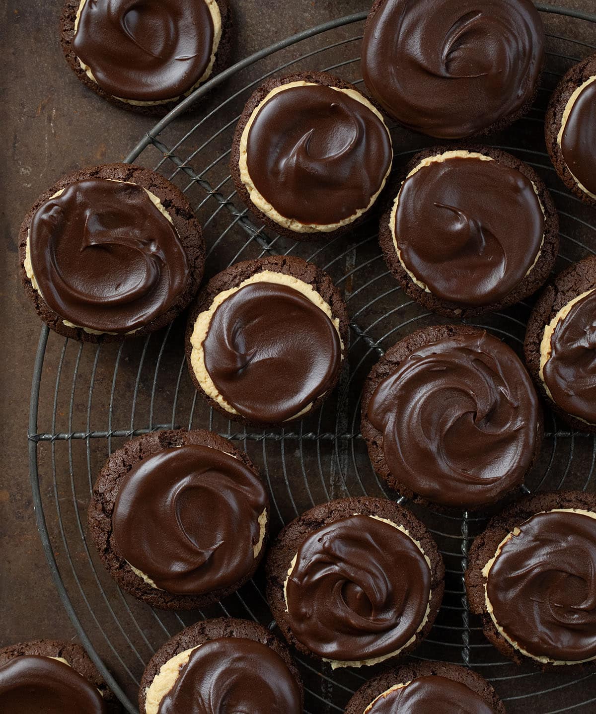 Buckeye Cookies on a cooling rack on a dark table from overhead.