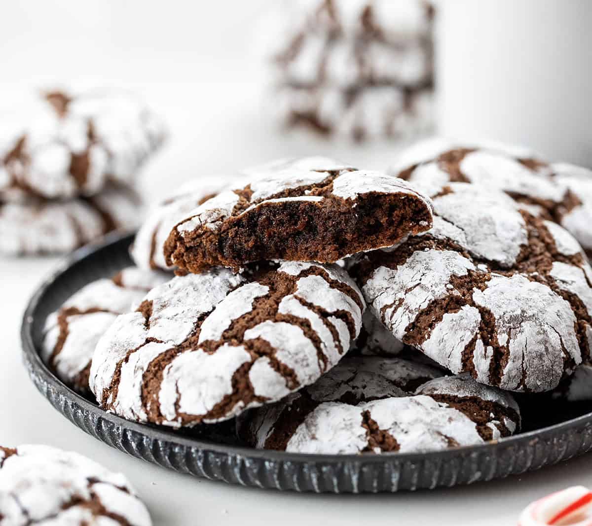 Plate of Chocolate Peppermint Crinkle Cookies on a white christmas table.