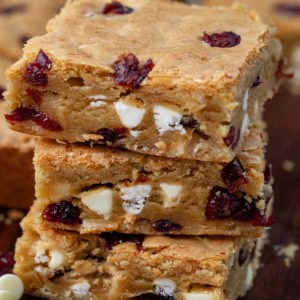 Close up of a stack of Cranberry White Chocolate Blondies.