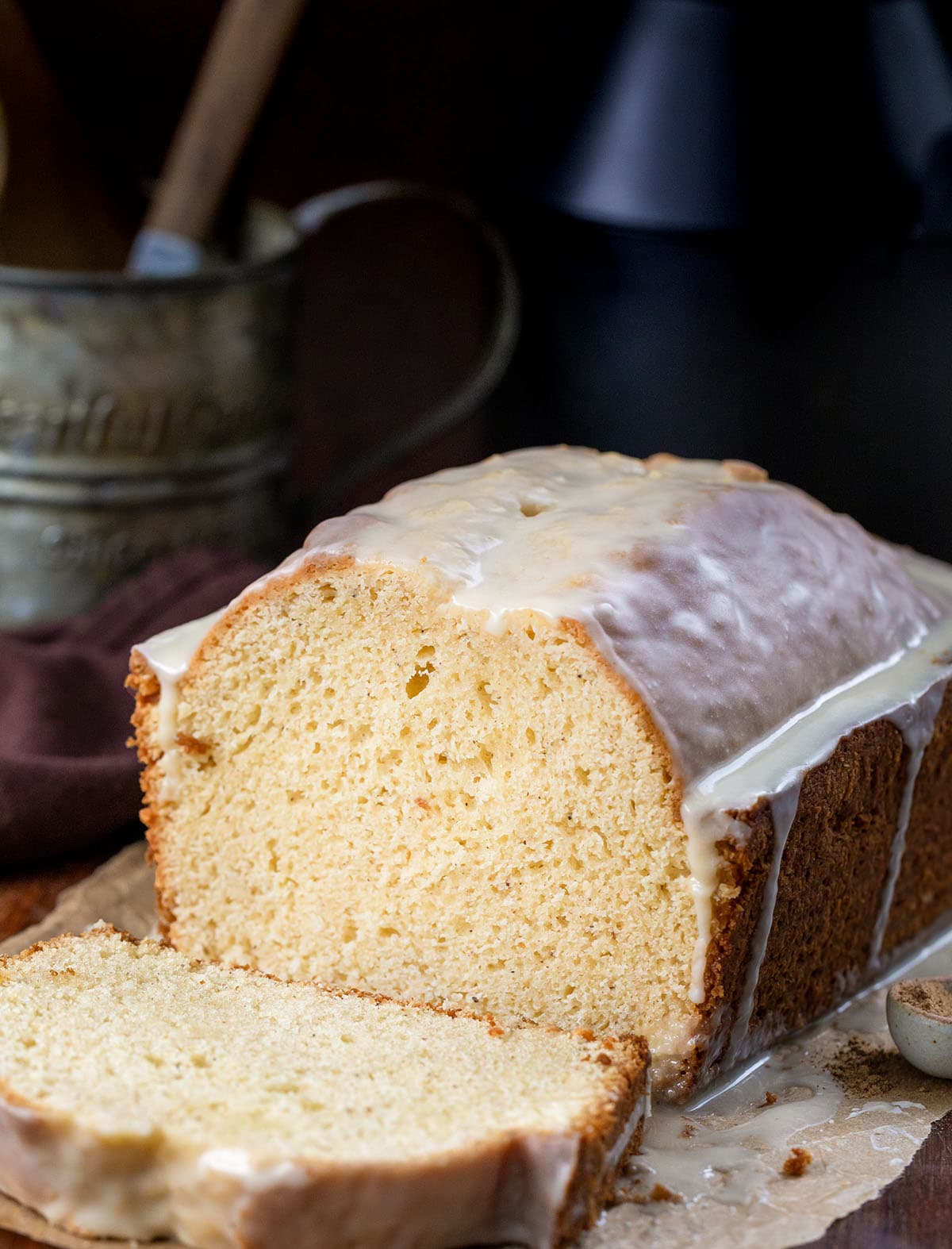 Loaf of Eggnog Bread that has been cut into some slices and showing inside texture.