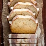 Sliced Eggnog Bread on a wooden table from overhead.