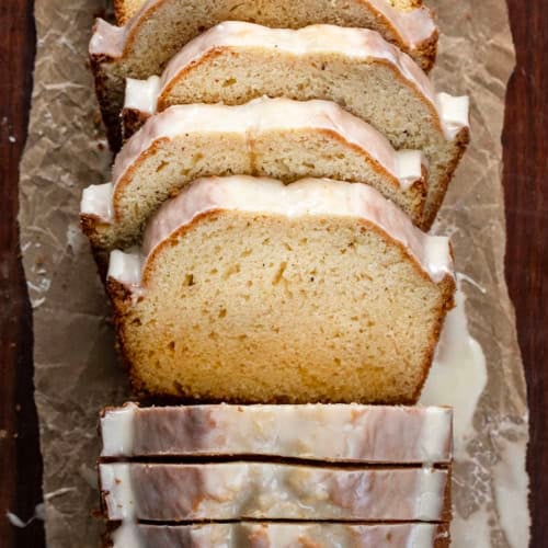 Sliced Eggnog Bread on a wooden table from overhead.