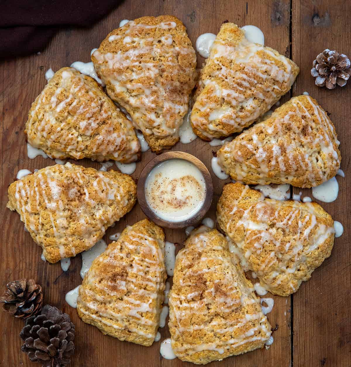 Eggnog Scones on a wooden table from overhead.