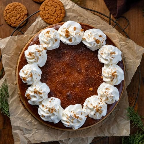 Gingerbread Cheesecake on a wooden table from overhead.
