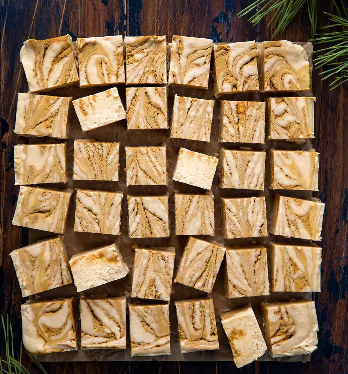 Gingerbread Fudge cut into squares on a wooden table from overhead.