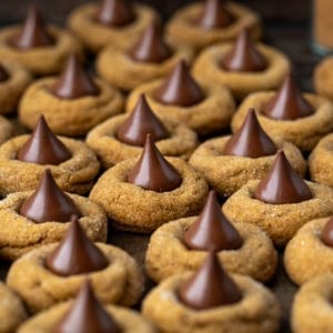 Multiple Gingerbread Kiss Cookies close together.