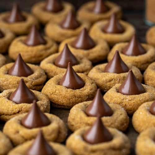 Multiple Gingerbread Kiss Cookies close together.