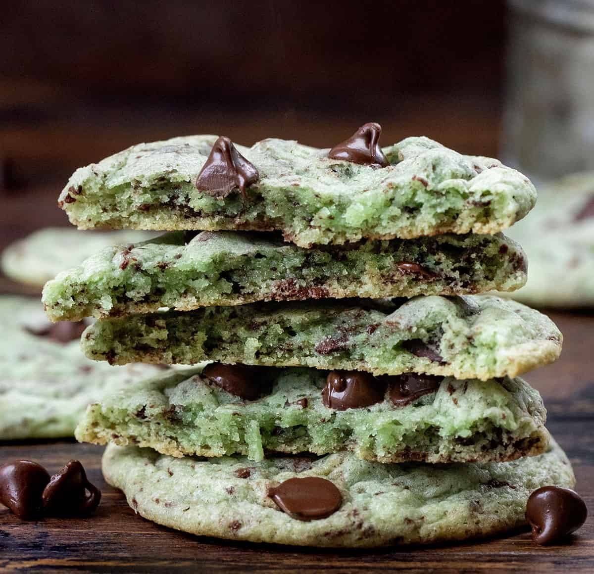 Stack of halved Mint Chocolate Chip Cookies showing the tender texture inside.