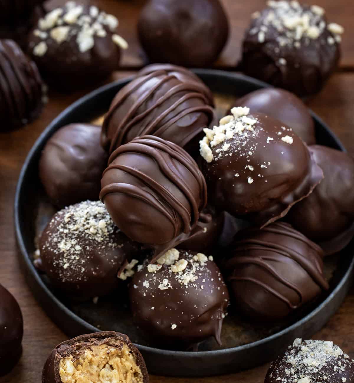 These Peanut Butter Balls with Rice Krispies are sweet, crunchy, and totally irresistible! Creamy peanut butter meets crispy cereal and a rich chocolate coating, making them the perfect treat!