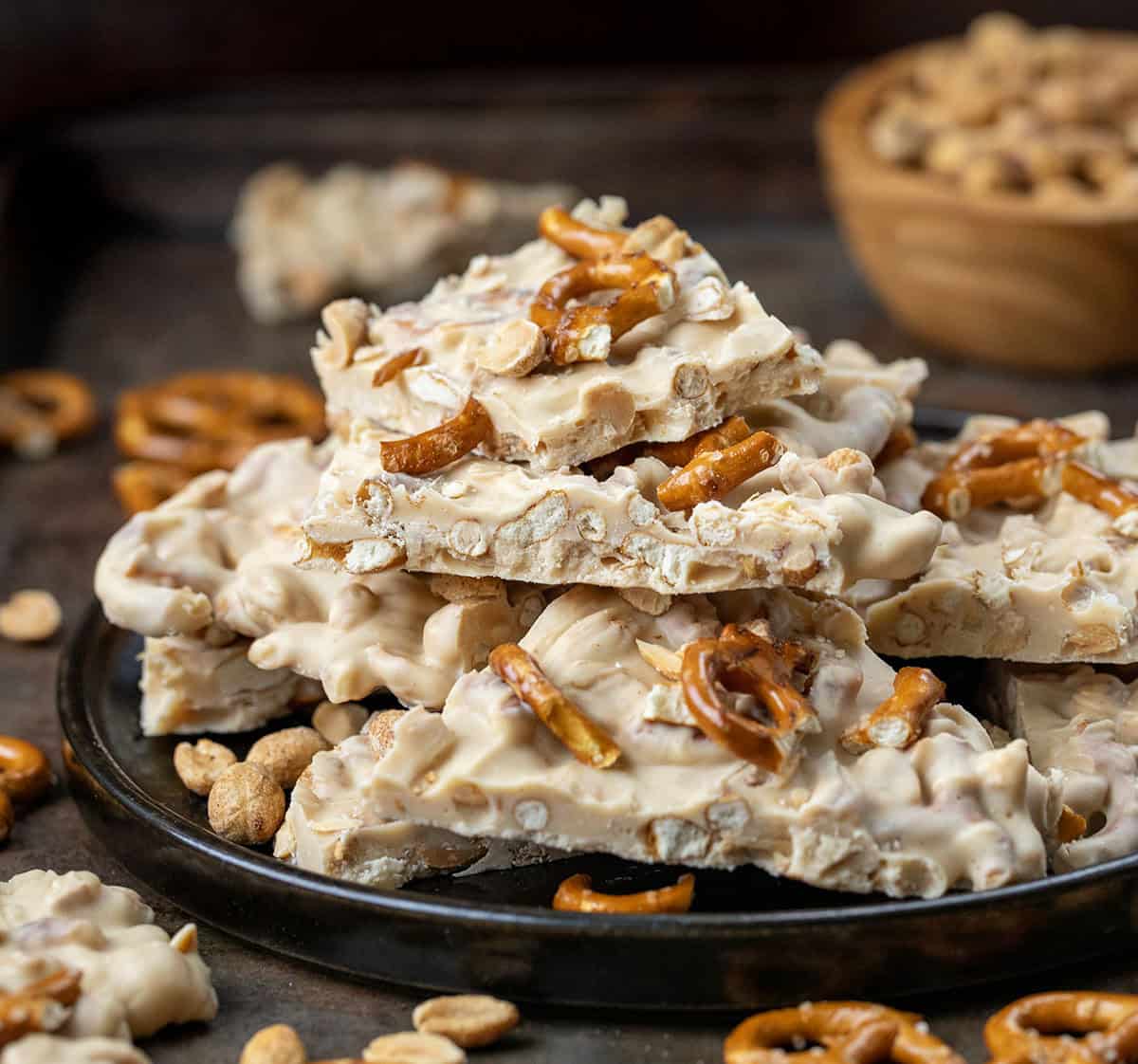 Platter of White Chocolate Peanut Butter Pretzel Bark broken into pieces.