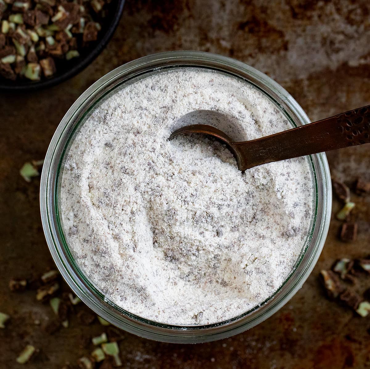 Looking down on a glass container of Andes Hot Cocoa Mix.