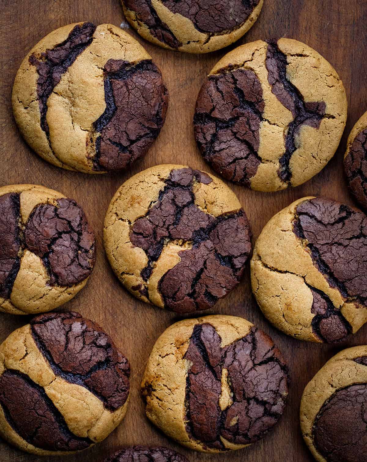 Ginger Brownie Cookies laid out on a wooden table from overhead.