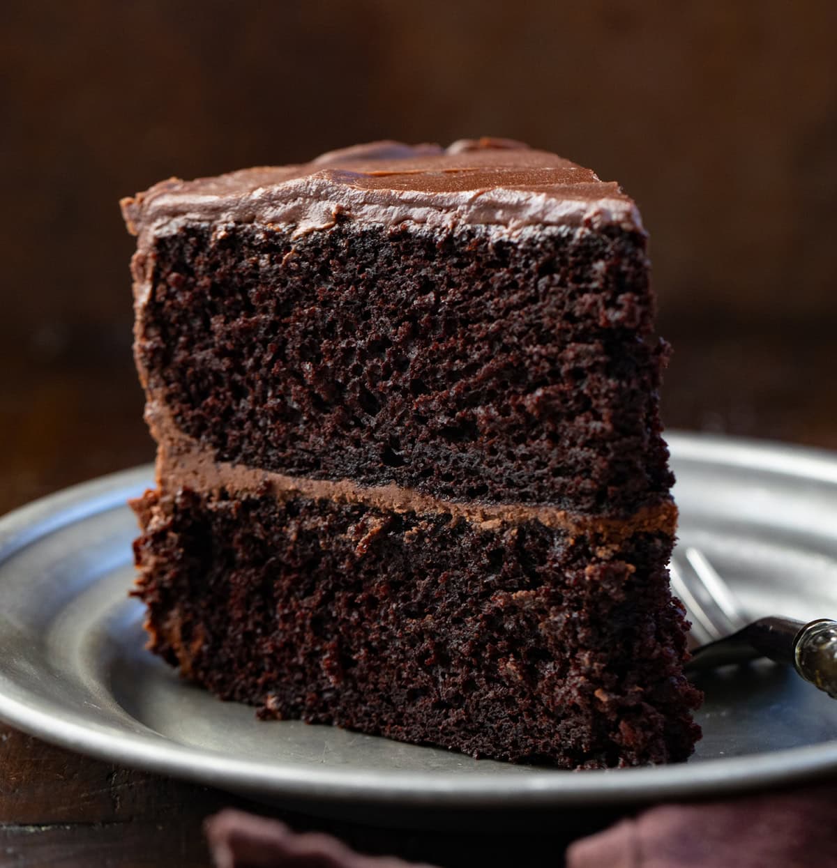 Slice of Devil's Food Cake on a plate with a fork.