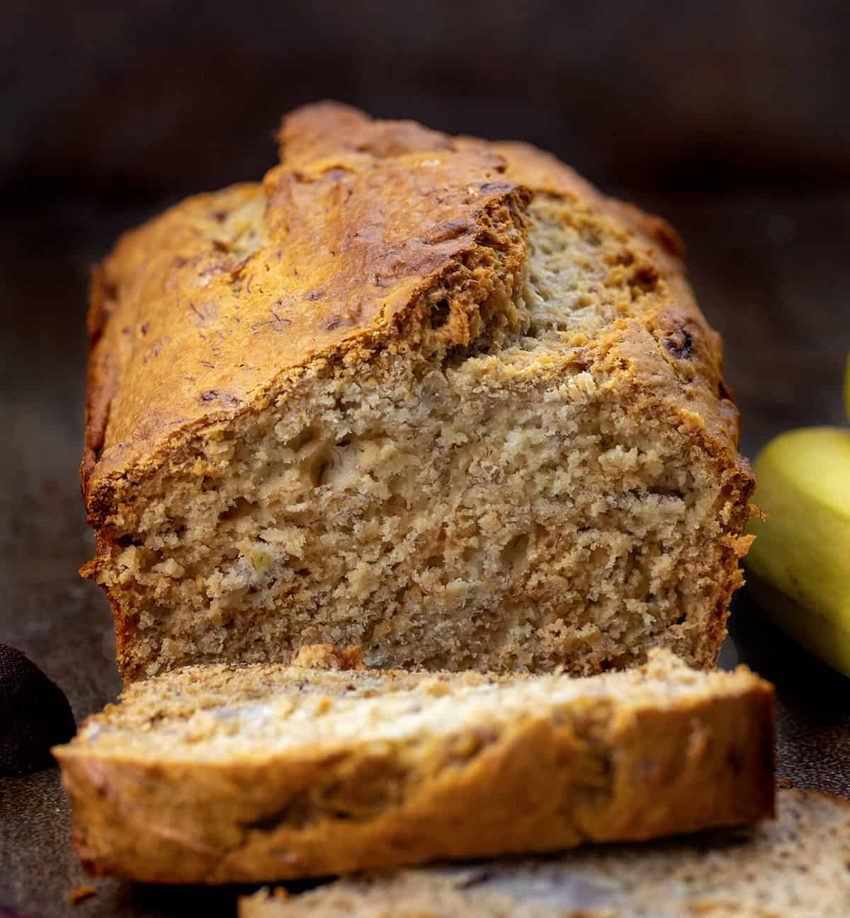 This Honey Banana Bread is a cozy quick bread that’s naturally sweetened with honey instead of sugar. The bananas keep the loaf soft and moist, and the honey gives a warm flavor and golden edges! Cut into loaf of Honey Banana Bread
