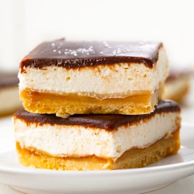 CLose up of Millionaire's Cheesecake Bars on a white plate.