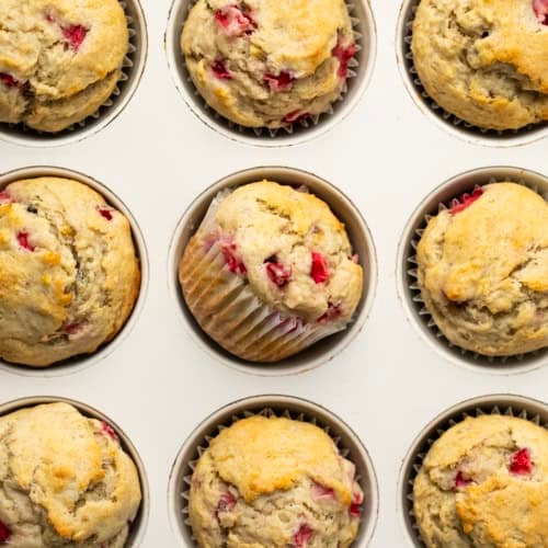 Strawberry Banana Muffins in a muffin pan close up.