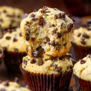 Stacked Banana Chocolate Chip Muffins with the top muffin halved.
