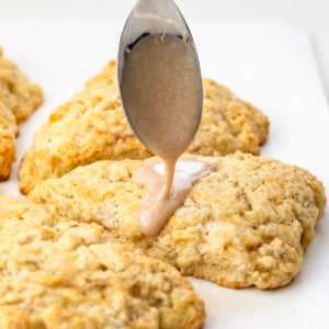 Drizzling maple glaze over Banana Scones.