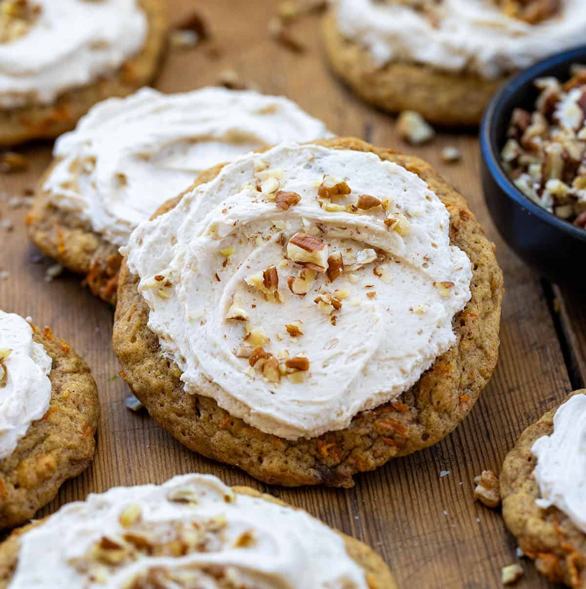 Close up of Carrot Cake Cookies on a wooden table.