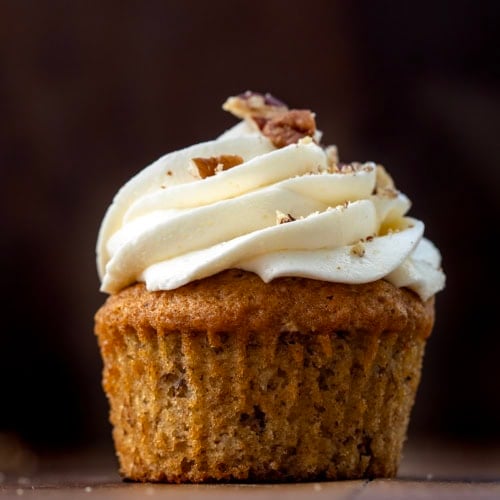 Close up of Hummingbird Cupcake on a wooden table.